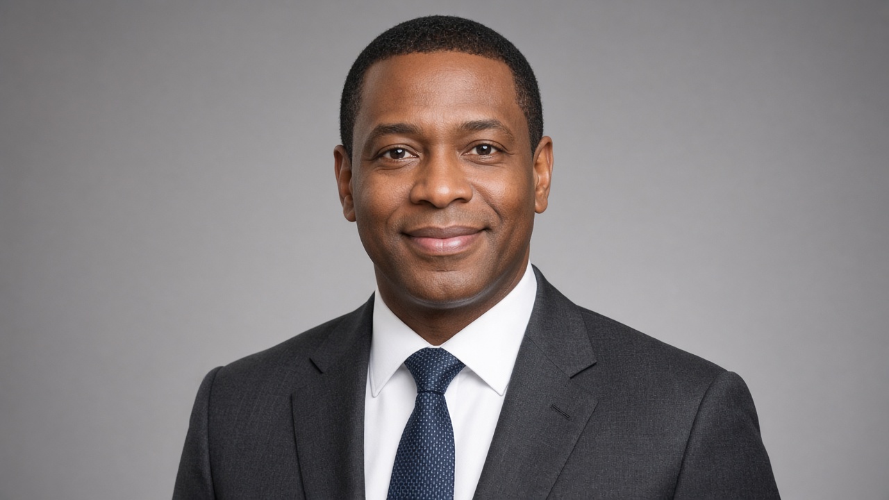 Professional man in a suit smiling in a headshot